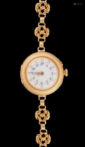 Horlogerie: Montre-bracelet en or jaune et émail.Dim.: diamè...