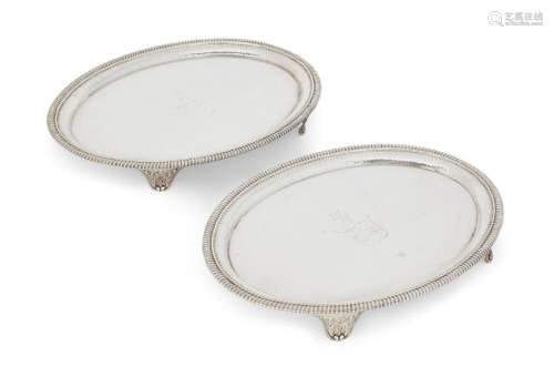 A PAIR OF GEORGE III OVAL SILVER WAITERS, LONDON, 1801, THOM...