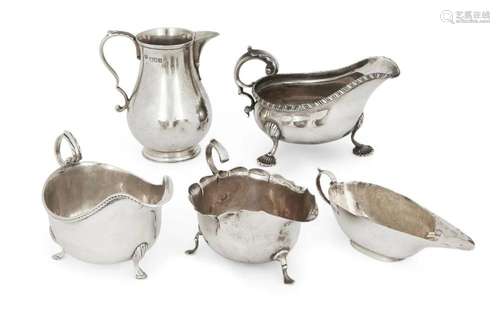 FIVE SILVER CREAM AND GRAVY JUGS, INCLUDING A BALUSTER SHAPE...