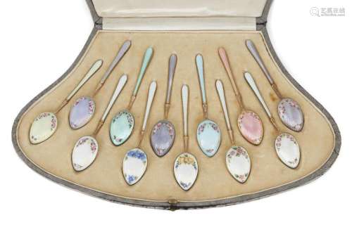 A MATCHED SET OF TWELVE FLORAL DECORATED GUILLOCHÉ ENAMELLED...