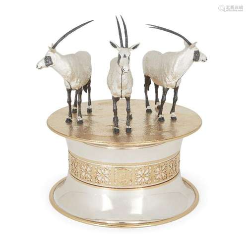 A SILVER PARCEL GILT STATUE OF THREE ARABIAN ORYX, BY GEORGE...