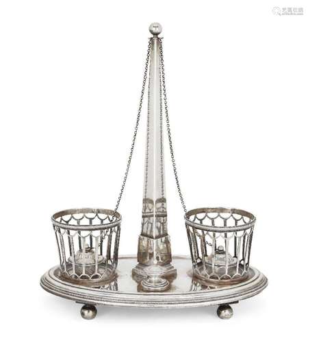 A CONTINENTAL WHITE METAL CRUET STAND, OF OVAL FORM, WITH TW...