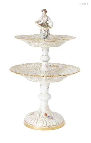 A MEISSEN TWO TIER CAKE STAND, 20TH CENTURY, SURMOUNTED BY A...