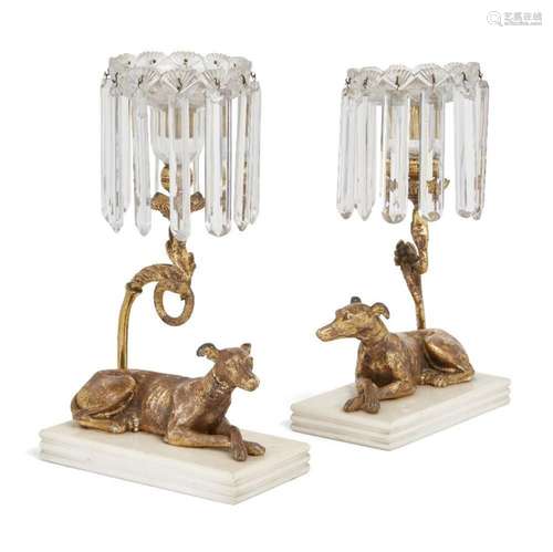 A PAIR OF REGENCY GILT GESSO GREYHOUND LUSTRE CANDLESTICKS, ...