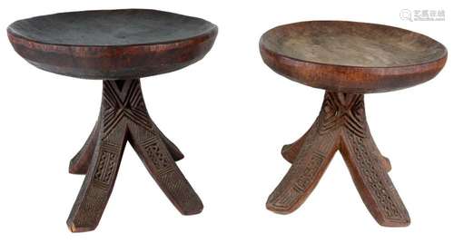 AN ASHANTI STOOL, THE BOWED RECTANGULAR SEAT, ABOVE A SUPPOR...