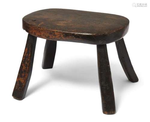 AN ASH AND FRUITWOOD MILKING STOOL, PROBABLY WELSH, EARLY 19...