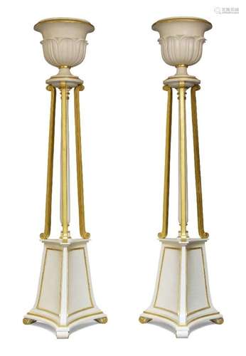 A PAIR OF MODERN WHITE AND GILT PAINTED TORCHERE FLOOR STAND...