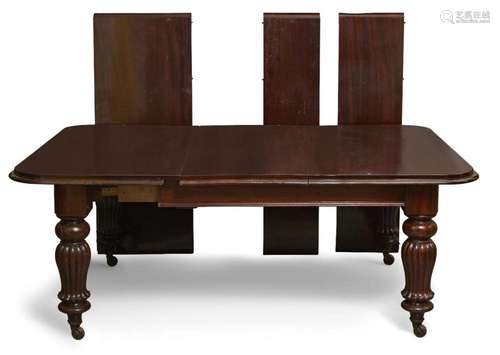 A LARGE VICTORIAN MAHOGANY EXTENDING DINING TABLE, THE ROUND...