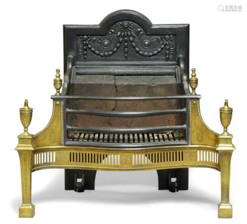 AN EDWARDIAN CAST IRON AND BRASS FIRE GRATE, OF GEORGE III S...