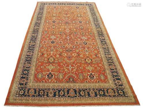 A LARGE PERSIAN SUMAK RUG, LATE 20TH CENTURY, THE TERRACOTTA...