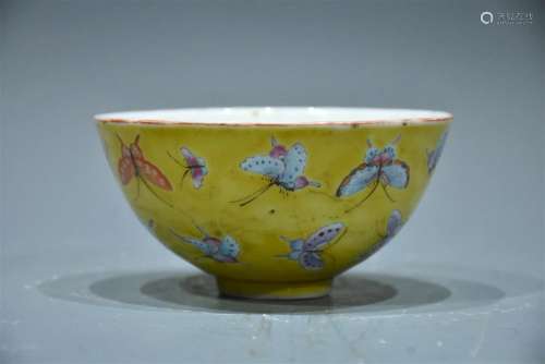 A FAMILLE-ROSE DECORATED YELLOW-GLAZED DEEP BOWL QING DYNAST...