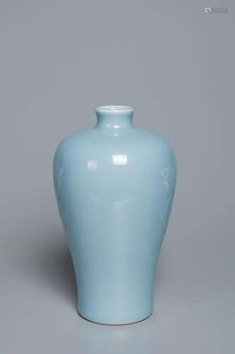 A PALE BLUISH-WHITE-GLAZED CARVED TAOTIE MASK VASE QING DYNA...