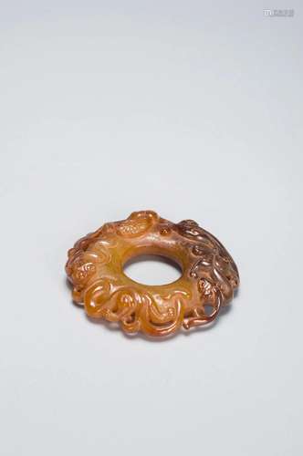 A CHINESE BROWN JADE BI HAN DYNASTY