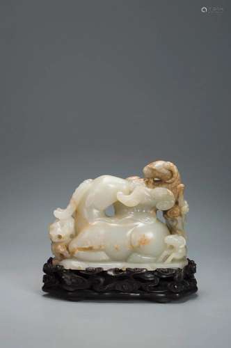 A WHITE AND BROWN JADE THREE SHEEP QING DYNASTY