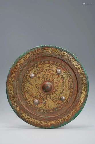 A BRONZE INLAID GOLD WIRE CIRCULAR MIRROR EASTERN HAN DYNAST...