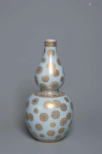 A GILT-DECORATED AND PALE GREENISH-GLAZE GOURD VASE QING DYN...