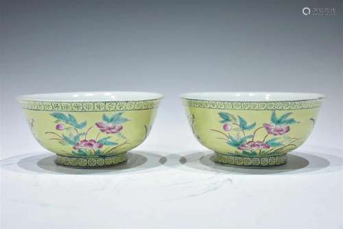 A PAIR OF FAMILLE-ROSE DECORATED YELLOW-GLAZED BOWLS QING DY...