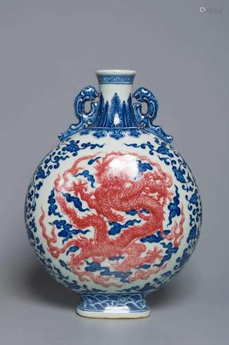 A BLUE AND WHITE AND UNDERGLAZE-RED â€œDRAGONâ€ VASE QING DY...