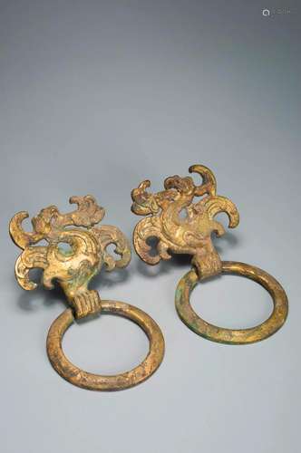 A PAIR OF GILT-BRONZE TAOTIE MASK FITTINGS TANG DYNASTY