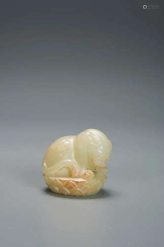 A SMALL WHITE JADE BUDDHIST LION YUAN DYNASTY