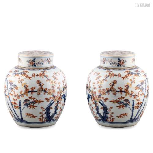 Pair of polychrome porcelain vases with lid