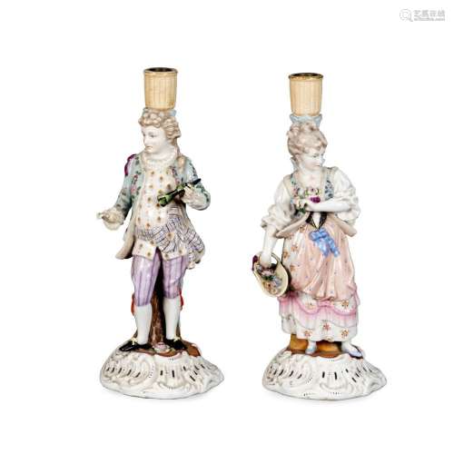 Pair of polychrome porcelain candlesticks