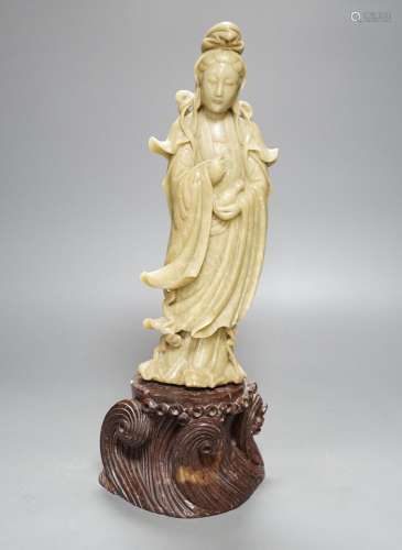A large Chinese soapstone figure of Guanyin, on base, 40cm