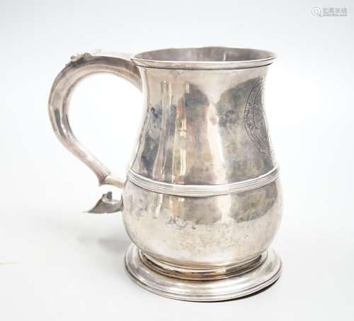 A George II silver baluster mug, with banded girdle, Benjami...