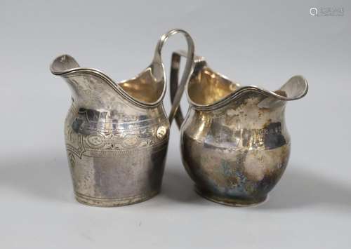 Two George III silver helmet shaped cream jugs, London, 1789...