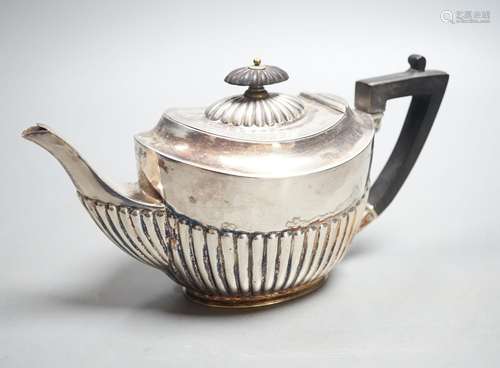 A late Victorian demi- fluted silver teapot, Sheffield, 1896...