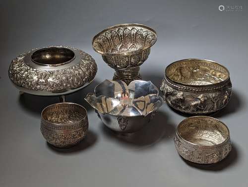 Six assorted embossed white metal bowls, including Indian an...