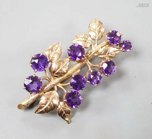 A modern 9ct gold and nine stone amethyst set spray brooch, ...