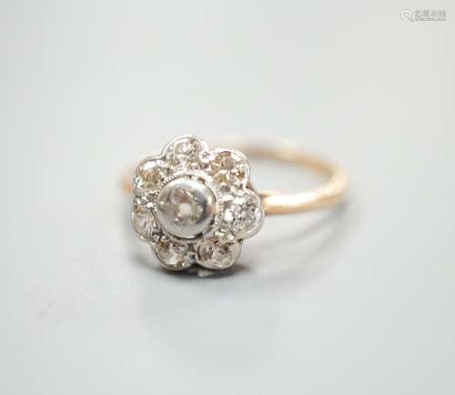 A yellow metal and eight stone diamond set flower head clust...