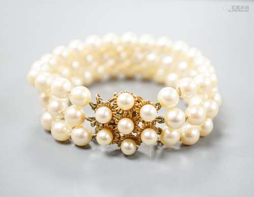 A triple strand cultured pearl bracelet, with yellow metal a...