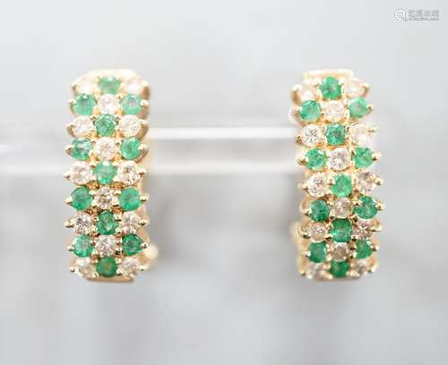 A pair of 14k yellow metal, emerald and diamond set curved e...