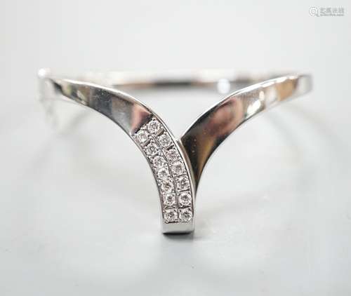 A modern 585 white metal and twelve stone diamond set wishbo...