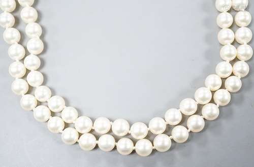 A modern single strand cultured pearl necklace, with diamond...