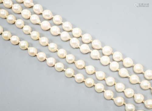 A modern long single strand cultured pearl necklace, with fl...