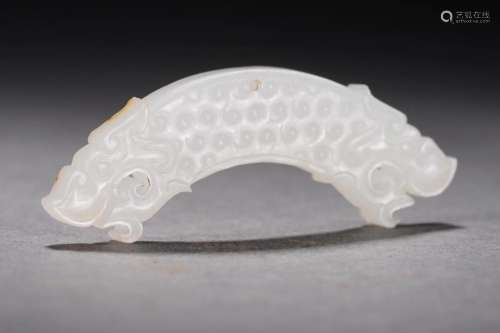 A Carved White Jade Huang