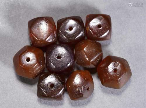 A Group of Nine Agate Beads