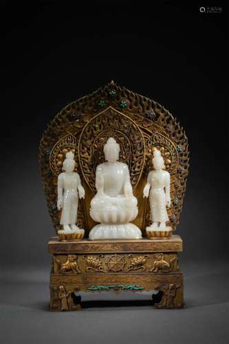 A Carved White Jade Buddha with Standing Accolytes