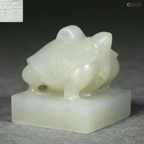 A Carved White Jade Tortoise Seal