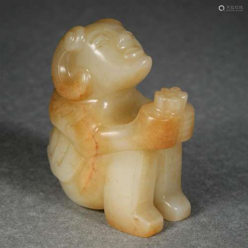 A Carved Jade Seated Figure