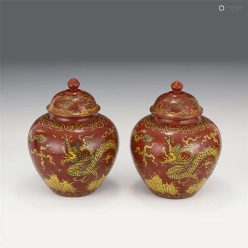 A PAIR OF CHINESE RED AND YELLOW GLAZED PORCELAIN LIDDED JAR...