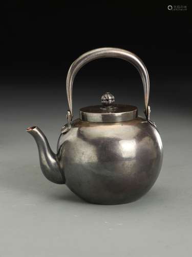 A SILVER TEAPOT