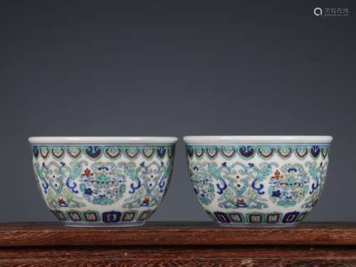 A  QIANLONG FINE PAIR OF DOUCAI ‘FLORAL’ CUPS