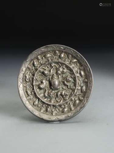 A TANG DYNASTY 'SQUIRREL AND GRAPEVINE' BRONZE MIRROR