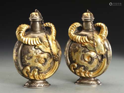 A PAIR OF GOLD OX BOTTLES