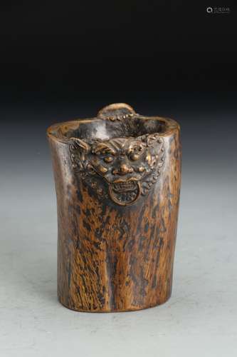 A  CHENXIANG WOOD TWO-HANDLED CUP