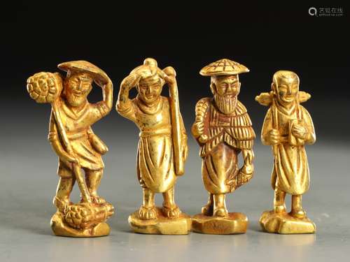 A SET OF FOUR GILT BRONZE FIGURE ORNAMENTS